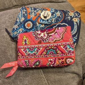 2 Vera Bradley wallets:  tri-fold in pink tones, turn lock in blue tones